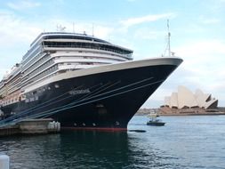 cruise ship in port in view of opera house, australia, sidney