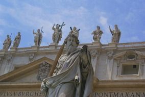 Statue of Saint Paul with faÃ§ade of St Peterâs Basilica, italy, rome, vatican