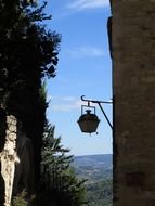 old street lantern on wall at idyll landscape, france, provence