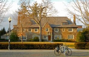 bicycles parked on street near old mansion at fall, usa, new jersey, princeton