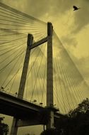 part of suspension bridge at cloudy sky