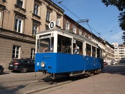 vintage blue tram on street, poland, krakow