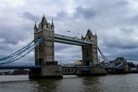 combined bascule and suspension tower bridge across thames river, uk, england, london