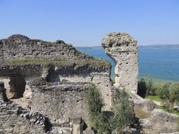 ancient roman villa ruin on rock at sea, italy, Grottoes of Catullus