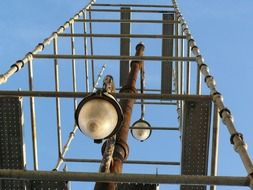 old street lamp in scaffolding, bottom view