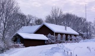 village house at snowy winter, sweden, vettershaga