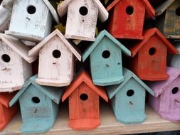 pile of cute colorful bird houses