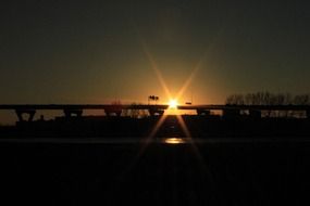 sunset behind the bridge