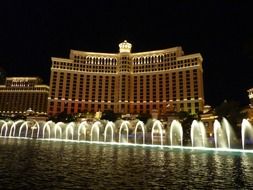 glowing fountains with colorful lights at night in Las Vegas