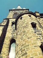 low angle view of medieval church tower at sky, germany