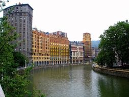 scenic buildings on waterfront at summer, spain, bilbao