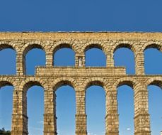 ancient roman aqueduct at sky, spain, segovia