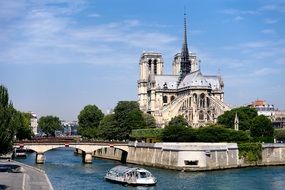 tourist boat on seine river at notre dame cathedral, france, paris