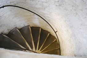 fragment of spiral staircase with railing