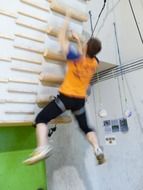 picture of strong young man on climbing wall