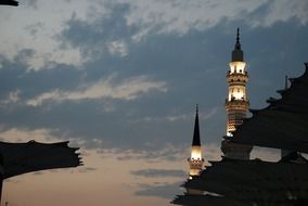 illuminated minarets at evening sky, Saudi Arabia, mecca