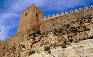 tower and wall of medieval moorish fortress at sky, spain, andalusia, alcazaba of almeria