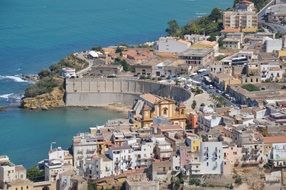 view of a city on the coast in sicily