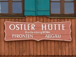 ostler hut, vintage building name board on facade of rest house close up, germany, Allgäu