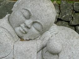 sleeping man, buddhist stone sculpture
