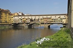 Ponte Vecchio, medieval stone bridge, view from arno riverside, italy, florence