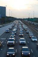 cars in rows on wide highway in downtown