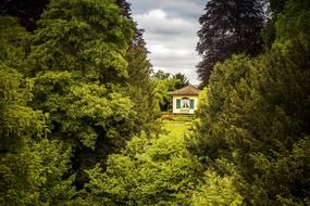 traditional village house among green trees, switzerland, andelfingen