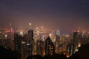 top view of night city in fog, china, hong kong