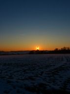 wintry field landscape at dusk