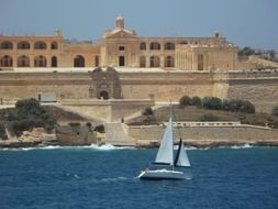 sailing boat on the sea at aged Fort Manoel, malta, Gżira