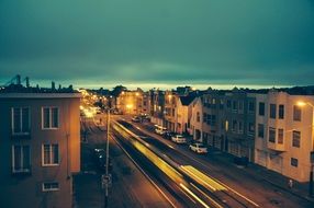 traffic on street of town in dusk