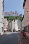 Trausnitz castle on hill above medieval alley, germany, landshut