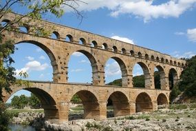 Pont du Gard, ancient roman Aqueduct bridge in countryside at summer, france, provence