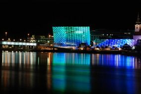 Ars Electronica Center, illuminated building on waterfront at night, Austria, Linz