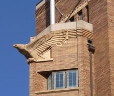 eagle sculpture on brick facade, usa, iowa, sioux city