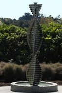 Turbinated form of fountain in a green park