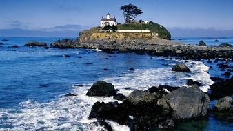 battery point lighthouse on rocky coast at sea, usa, california, Crescent City