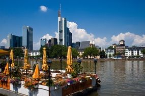 open air cafe on river at city skyline, germany, frankfurt am main