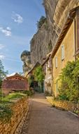 old buildings on alley at cliff, france, dordogne
