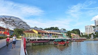 people walking on water front at city, singapore, clarke quay