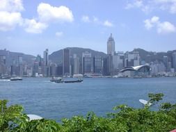 waterfront of modern city at mountains, china, hong kong