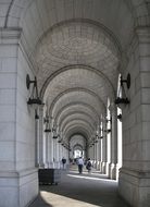 people walking in arched passage of union station building, usa, washington dc