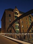 photo of the bridge and building at night in Hamburg