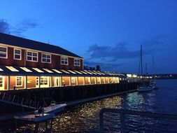 restaurant with boardwalk on waterfront at dusk,canada, nova scotia, halifax