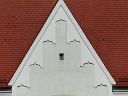 red tile roof with gable ornament