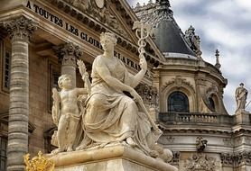 Allegorical sculpture near main entrance to Versailles Palace, france, paris