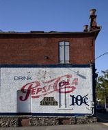 Vintage advertisement on a brick wall