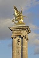 Fame in Combat golden statue at sky, france, paris