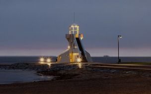 Majakka, modern lighthouse at sea on nallikari beach in dusk, finland, oulu