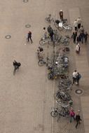 people with bicycles on parking, top view